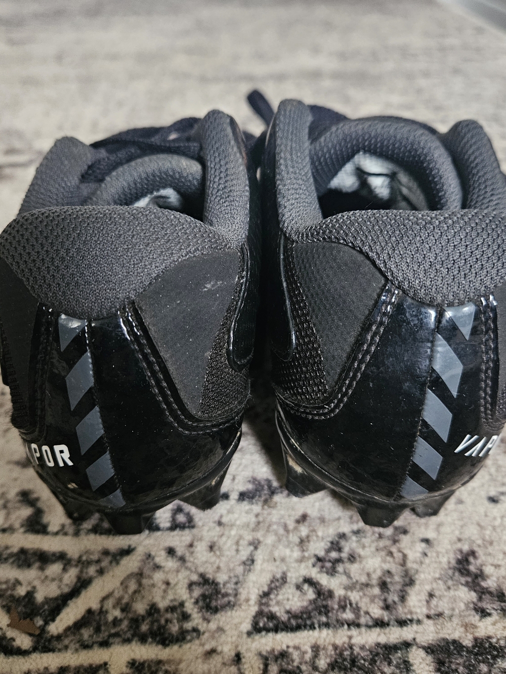 Nike Black Athletic Cleats with White Swoosh - Picture 3 of 4